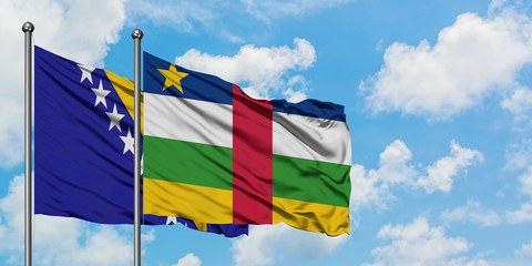 Bosnia Herzegovina and Central African Republic flag waving in the wind against white cloudy blue sky together. Diplomacy concept, international relations.