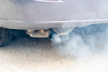 Car exhaust pipe coming out of the diesel exhaust. Concept: transport or health protection
