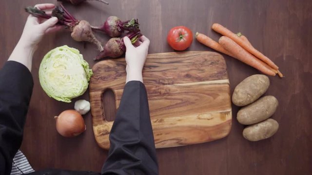 Step by step. Flat lay. Preparing ingredients to cook beet soup, borscht.