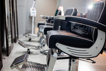 empty barbershop, hairdresser's interior, comfortable chairs and modern design, free and clean workplace