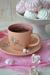 Meringue zephyr or marshmallow in pink and white colors with cup of coffee americano. Valentine's or Mothers Day concept, gentle morning concept