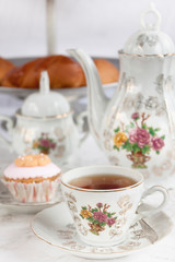 Obraz na płótnie Canvas tea set with dessert and bread
