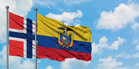 Bouvet Islands and Ecuador flag waving in the wind against white cloudy blue sky together. Diplomacy concept, international relations.