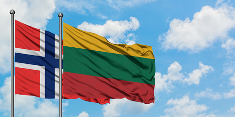 Bouvet Islands and Lithuania flag waving in the wind against white cloudy blue sky together. Diplomacy concept, international relations.