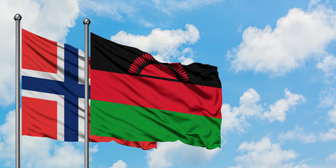 Bouvet Islands and Malawi flag waving in the wind against white cloudy blue sky together. Diplomacy concept, international relations.