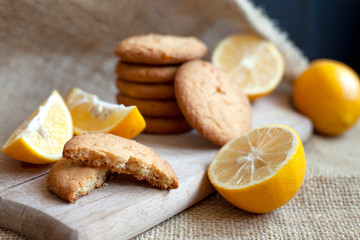 Fototapeta na wymiar lemon cookies made at home, citrus baking deliciously lies on a table in a paper wrapper, a recipe for fruit baking