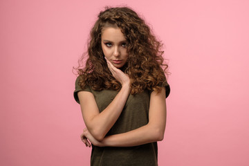 Pretty girl with toothache on pink background