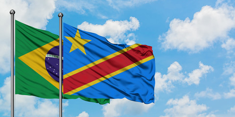 Brazil and Congo flag waving in the wind against white cloudy blue sky together. Diplomacy concept, international relations.