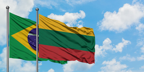 Brazil and Lithuania flag waving in the wind against white cloudy blue sky together. Diplomacy concept, international relations.