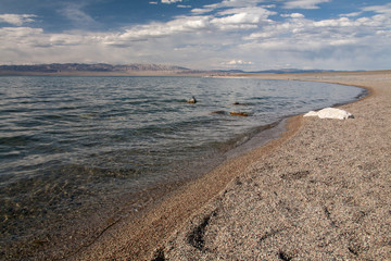 Cloudy sunset on a mountain lake. Mongolia