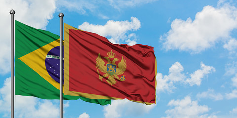 Brazil and Montenegro flag waving in the wind against white cloudy blue sky together. Diplomacy concept, international relations.