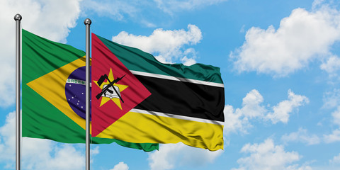 Brazil and Mozambique flag waving in the wind against white cloudy blue sky together. Diplomacy concept, international relations.