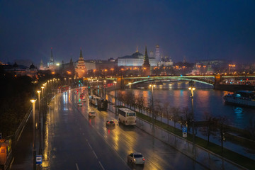 Fototapeta na wymiar Awe view on Kremlin and Moscow river at night. Rain.