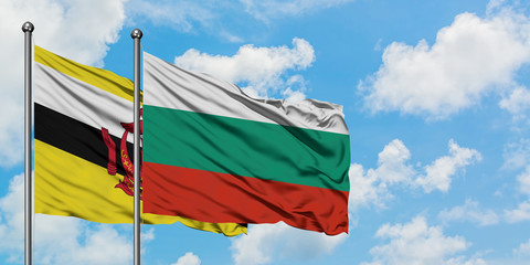 Brunei and Bulgaria flag waving in the wind against white cloudy blue sky together. Diplomacy concept, international relations.