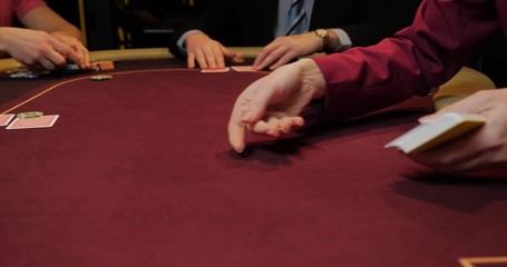 Dealer shuffles the poker cards - Powered by Adobe