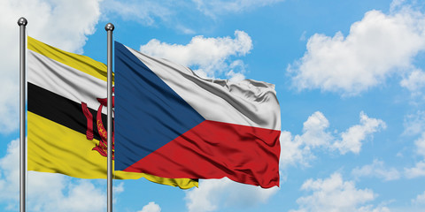 Brunei and Czech Republic flag waving in the wind against white cloudy blue sky together. Diplomacy concept, international relations.