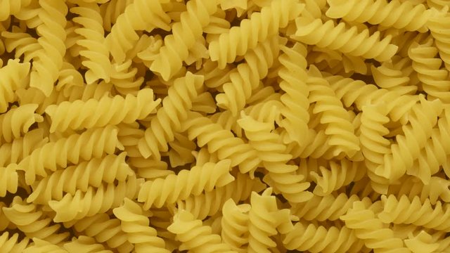 Pile of raw Italian fusilli pasta rotating 360 degrees