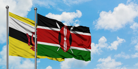 Brunei and Kenya flag waving in the wind against white cloudy blue sky together. Diplomacy concept, international relations.