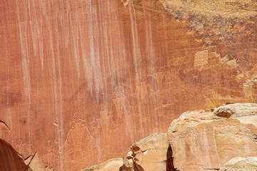 Ancient Fremont People petroglyphs make present day visitor aware of their existence oin the sandstone walls of Capitol Reef National Park, Utan