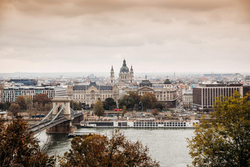 Fototapeta na wymiar Autumn in Budapest - a view over Danube River and Parliament