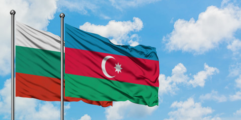 Bulgaria and Azerbaijan flag waving in the wind against white cloudy blue sky together. Diplomacy concept, international relations.