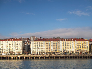 Fototapeta na wymiar Sunny buildings in the bay of Santander