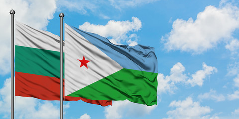 Bulgaria and Djibouti flag waving in the wind against white cloudy blue sky together. Diplomacy concept, international relations.