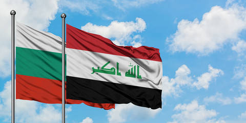 Bulgaria and Iraq flag waving in the wind against white cloudy blue sky together. Diplomacy concept, international relations.