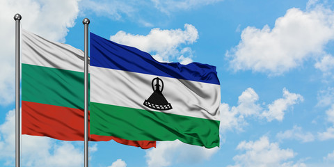 Bulgaria and Lesotho flag waving in the wind against white cloudy blue sky together. Diplomacy concept, international relations.