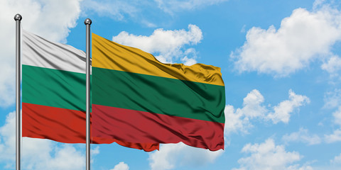 Bulgaria and Lithuania flag waving in the wind against white cloudy blue sky together. Diplomacy concept, international relations.