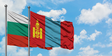 Bulgaria and Mongolia flag waving in the wind against white cloudy blue sky together. Diplomacy concept, international relations.