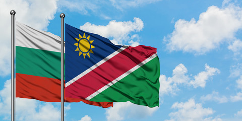 Bulgaria and Namibia flag waving in the wind against white cloudy blue sky together. Diplomacy concept, international relations.
