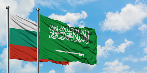 Bulgaria and Saudi Arabia flag waving in the wind against white cloudy blue sky together. Diplomacy concept, international relations.