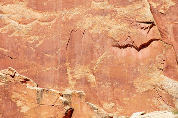 Ancient Fremont People petroglyphs make present day visitor aware of their existence oin the sandstone walls of Capitol Reef National Park, Utan