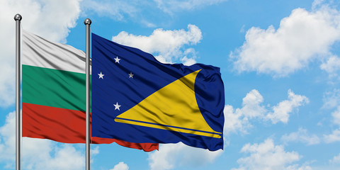 Bulgaria and Tokelau flag waving in the wind against white cloudy blue sky together. Diplomacy concept, international relations.