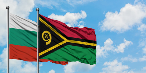 Bulgaria and Vanuatu flag waving in the wind against white cloudy blue sky together. Diplomacy concept, international relations.
