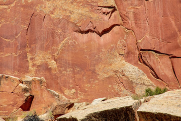 Ancient Fremont People petroglyphs make present day visitor aware of their existence oin the sandstone walls of Capitol Reef National Park, Utan