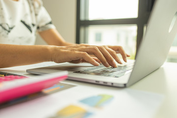 Businessman hands busy using laptop at office desk, young female student typing on computer sitting at wooden table