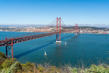 April 25 bridge with a view of Lisbon, in the summer. Portugal.