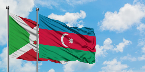 Burundi and Azerbaijan flag waving in the wind against white cloudy blue sky together. Diplomacy concept, international relations.