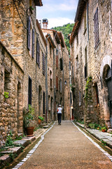 Narrow cozy streets of medieval picturesque town of Villefranche-de-Conflent, Occitanie, in the Pyrénées-Orientales department in southern France