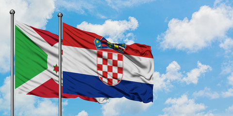 Burundi and Croatia flag waving in the wind against white cloudy blue sky together. Diplomacy concept, international relations.