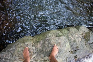 foots Standing on the rock 