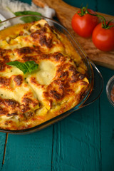 Delicious Lasagna, Italian cuisine. Pasta. Vertical frame with ingredients.