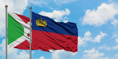 Burundi and Liechtenstein flag waving in the wind against white cloudy blue sky together. Diplomacy concept, international relations.