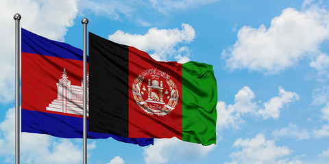 Cambodia and Afghanistan flag waving in the wind against white cloudy blue sky together. Diplomacy concept, international relations.