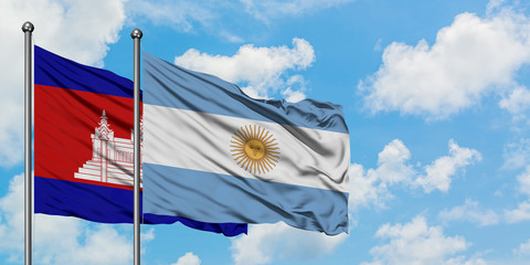 Cambodia and Argentina flag waving in the wind against white cloudy blue sky together. Diplomacy concept, international relations.