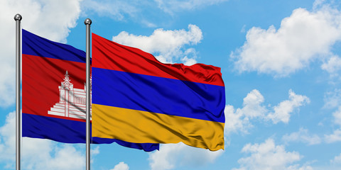 Cambodia and Armenia flag waving in the wind against white cloudy blue sky together. Diplomacy concept, international relations.