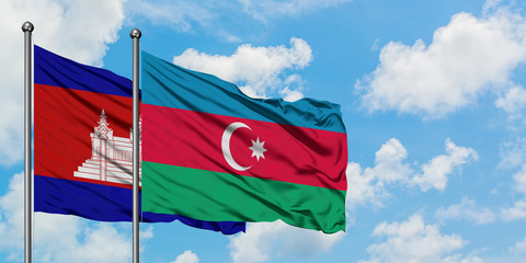 Cambodia and Azerbaijan flag waving in the wind against white cloudy blue sky together. Diplomacy concept, international relations.