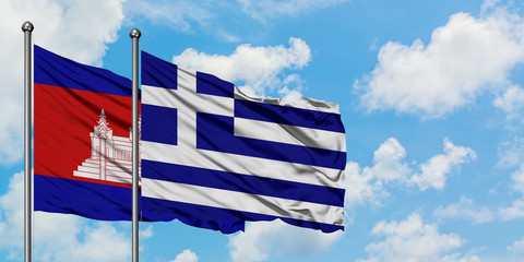Cambodia and Greece flag waving in the wind against white cloudy blue sky together. Diplomacy concept, international relations.